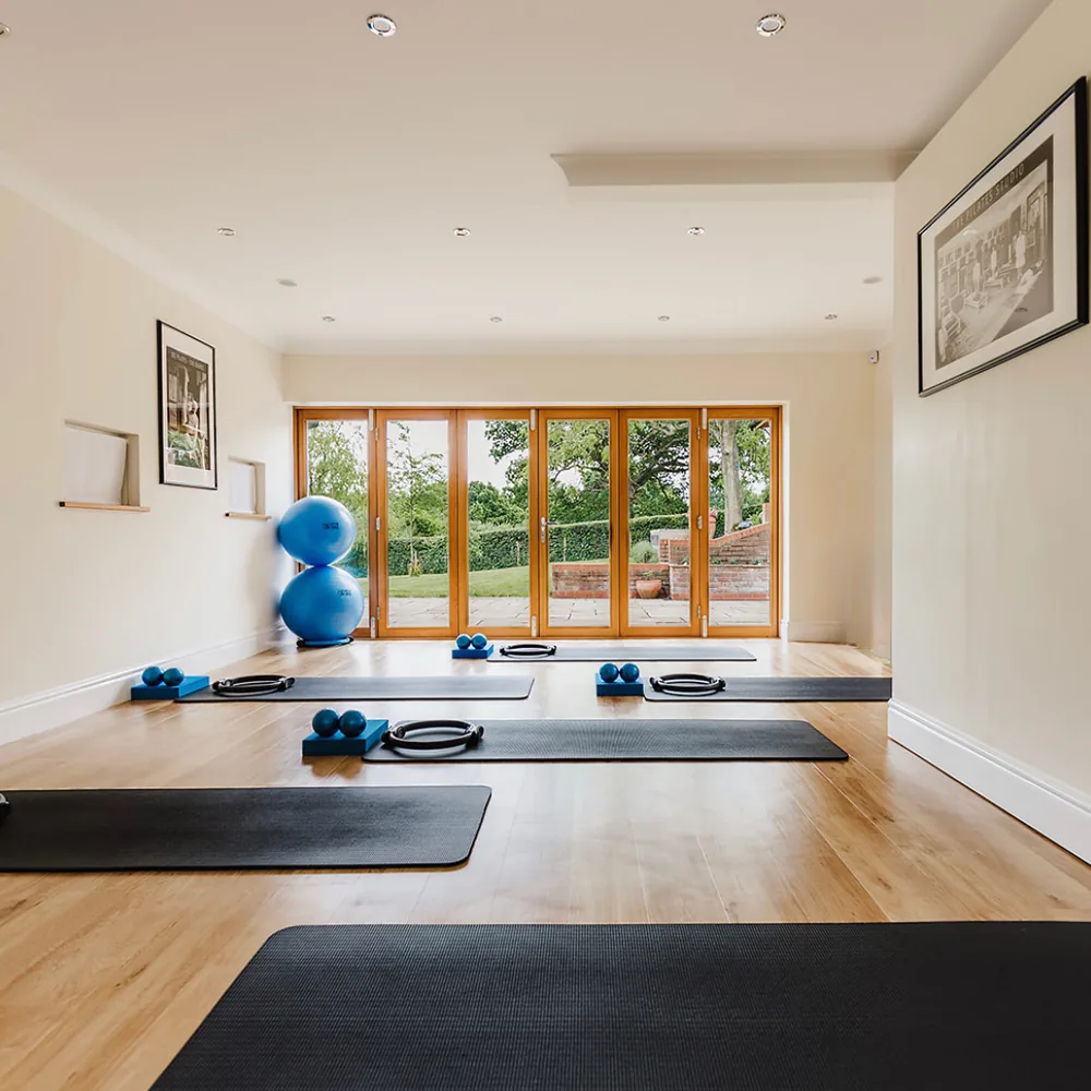 The room from the other end, mats laid out with a magic circle and weighted balls on each, the folding doors closed onto the terrace